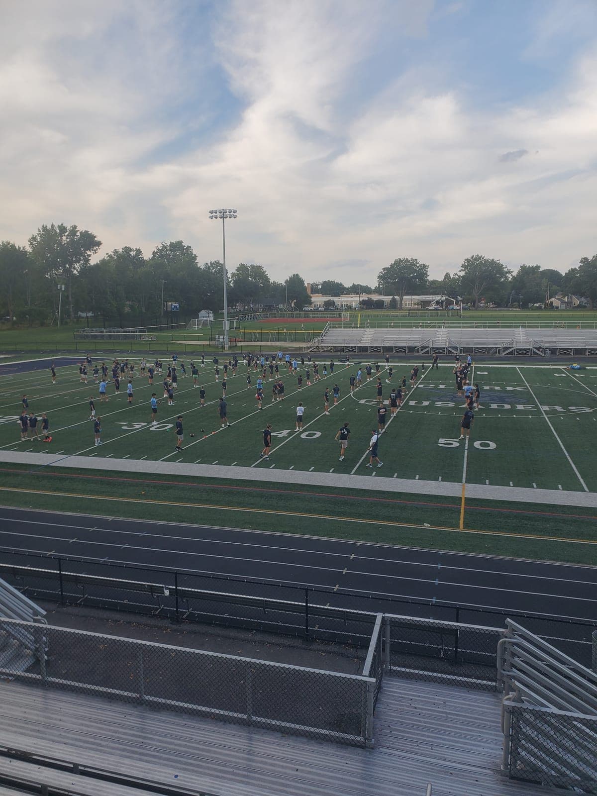 Clark Youth Football players participate in the Summer Clinic with Arthur L. Johnson High School student-athletes and coaches.